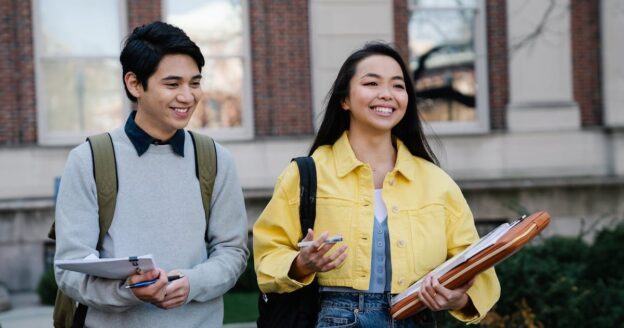 Two college students walking campus