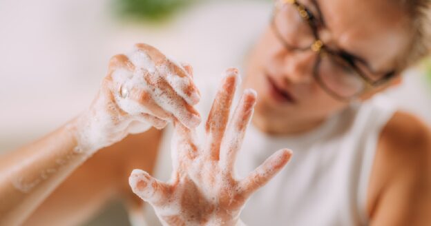 Woman with OCD washing her hands