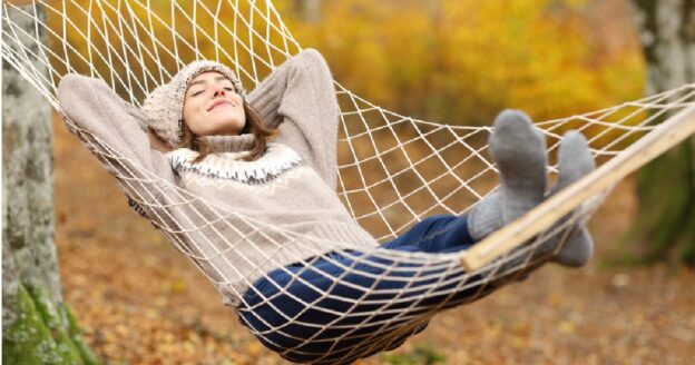 Relaxing on a hammock with colorful foliage in the background